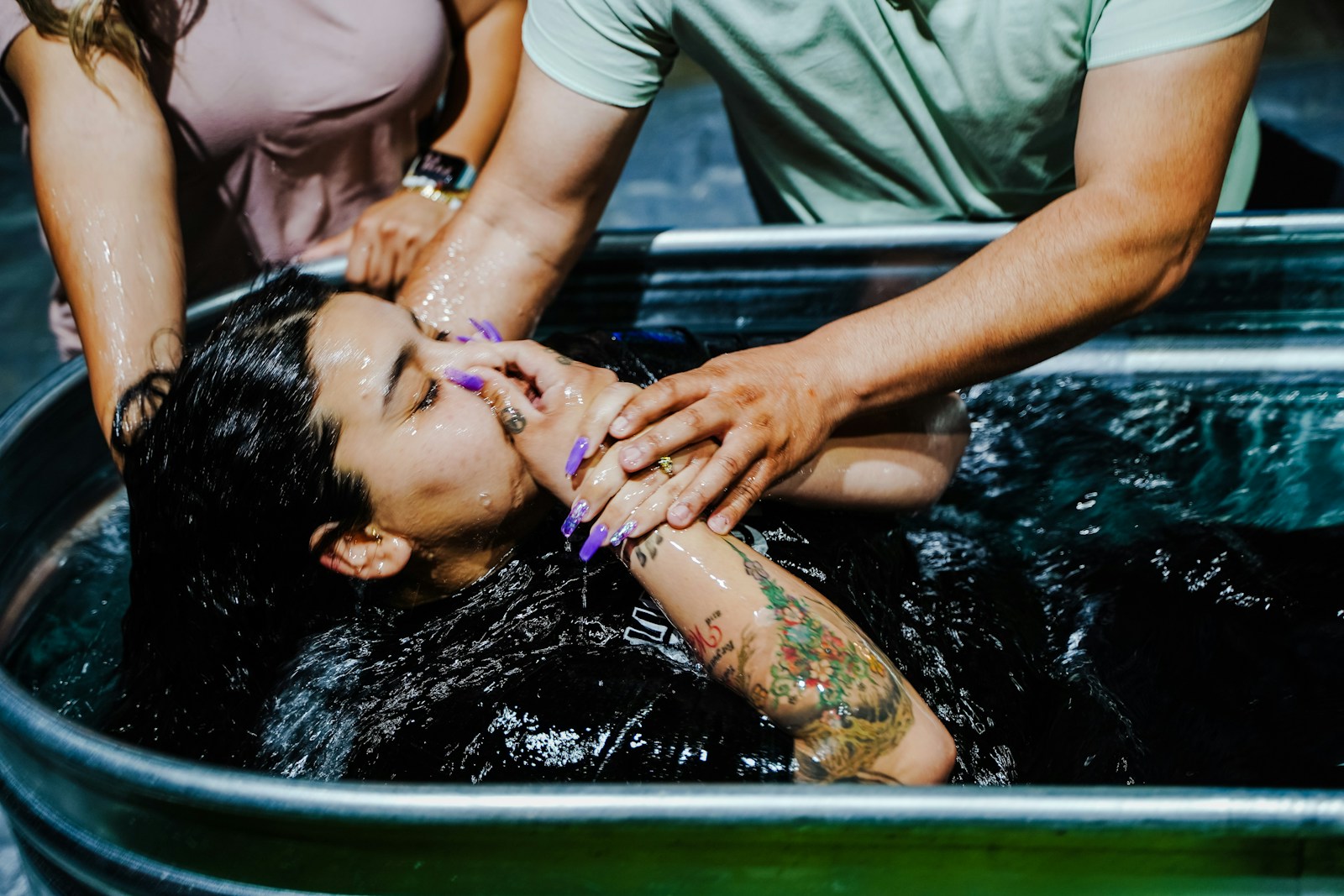 Photo by Josue Michel woman in grey t-shirt and black pants in water